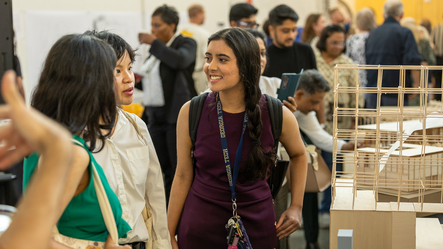 Students and guests examine architecture designs at Design Show 2025